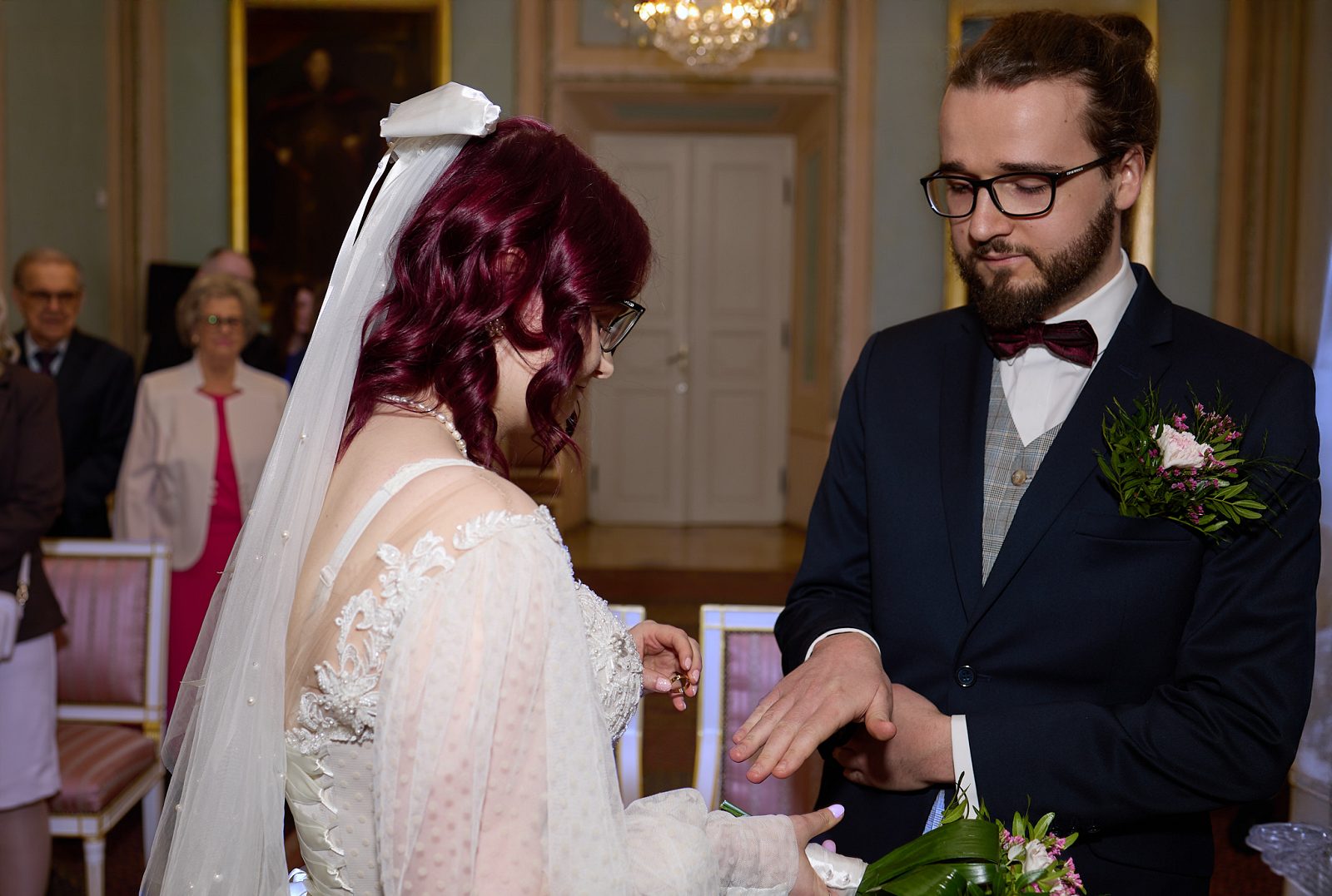 Groom holding out his hand to the bride for the exchange of rings at a civil wedding in Lublin