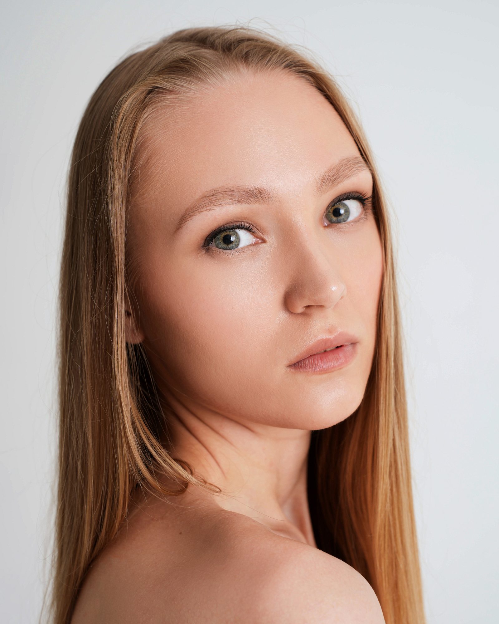 Close portrait of a woman with bare shoulders