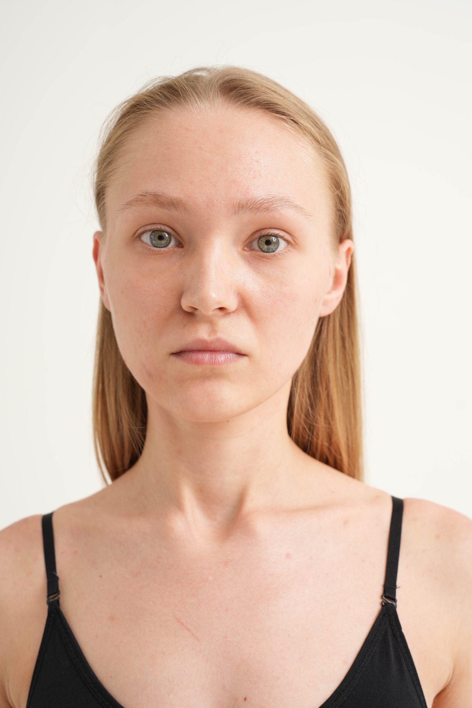 Close portrait of a woman against a white background